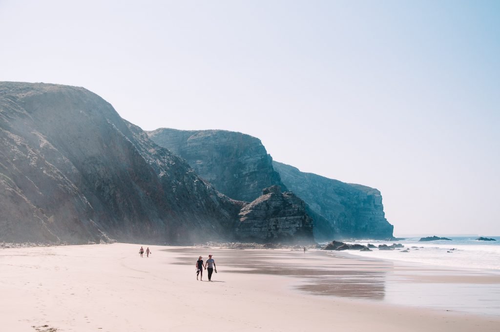 a couple holding hands in Portugal